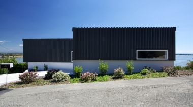 Designed by Archimetrix, a Christchurch-based consultancy, this new architecture, building, commercial building, corporate headquarters, facade, home, house, property, real estate, shed, sky, teal, gray