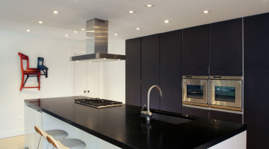 This kitchen designed by Nestor Santa-Cruz features a countertop, interior design, kitchen, real estate, room, gray, white
