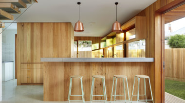 In this contemporary kitchen, an integrated refrigerator and architecture, cabinetry, home, house, interior design, lobby, real estate, wood, gray, brown