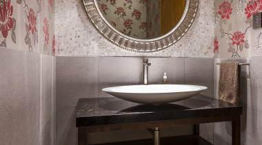 This powder room by designer Natalie Du Bois bathroom, ceramic, floor, flooring, interior design, room, sink, tile, wall, gray, black