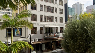 A rough-sawn timber spine runs the length of apartment, architecture, arecales, building, city, condominium, home, hotel, house, metropolitan area, mixed use, neighbourhood, palm tree, property, real estate, residential area, tree, urban design, black, white