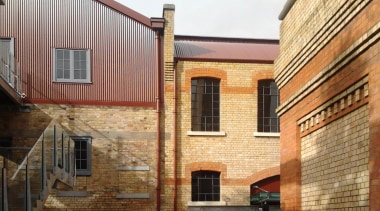 Historic buildings have a value to the community apartment, architecture, brick, brickwork, building, facade, home, house, neighbourhood, property, real estate, residential area, roof, siding, wall, window, brown