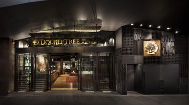 Raw and industrial, the exterior of the DoubleTree night, black