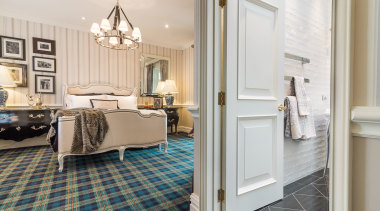 This guest room by Emma Morris is floor, flooring, home, interior design, real estate, room, suite, wall, window, wood flooring, white, gray