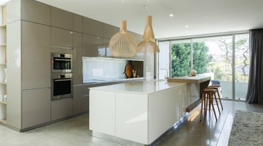 In this kitchen by Nancy Frost, reflective surfaces architecture, countertop, cuisine classique, interior design, kitchen, real estate, room, gray, white