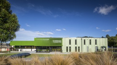 :Green mesh and patterned, pigmented green concrete envelope architecture, campus, cloud, corporate headquarters, daytime, estate, facade, grass, headquarters, home, house, property, real estate, sky, blue