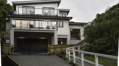 Reflecting on nature  this Lockwood home, built building, cottage, elevation, facade, home, house, property, real estate, residential area, white, black