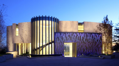 Dramatic entrance  a gently curving wall of architecture, building, corporate headquarters, estate, facade, home, house, lighting, property, real estate, tourist attraction, blue