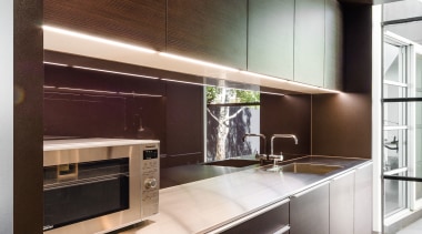 Clean surfaces and understated handles in this butlers cabinetry, countertop, furniture, interior design, kitchen, black