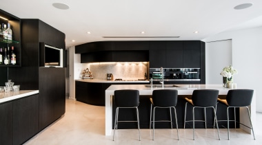 This bar area sits at the side of interior design, kitchen, living room, room, white, black