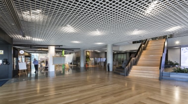 For an industrial touch, the foyer at the architecture, ceiling, daylighting, floor, flooring, interior design, lobby, gray