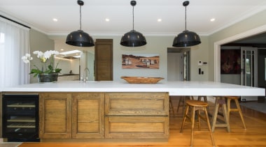 Crafted meets contemporary with this entertainers kitchen island, cabinetry, countertop, cuisine classique, furniture, hardwood, interior design, kitchen, room, table, gray