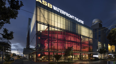 ASB Waterfront Theatre provides a permanent home for architecture, building, city, commercial building, corporate headquarters, downtown, facade, landmark, metropolis, metropolitan area, mixed use, night, sky, blue, black