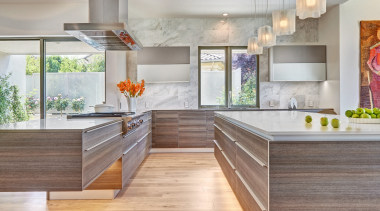 The dramatic cantilever in this kitchen is highlighted cabinetry, countertop, cuisine classique, floor, flooring, hardwood, interior design, kitchen, laminate flooring, wood flooring, gray