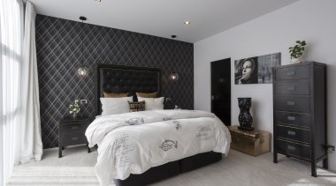 The use of black tones and lustrous hints bed frame, bedroom, ceiling, floor, furniture, home, interior design, room, wall, gray, black