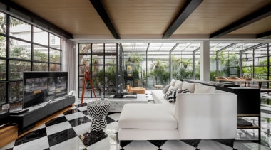 An expansive downstairs living space was transformed beyond architecture, house, interior design, living room, furniture, furnishings, tile floor,  glass extension, contemporary, renovation