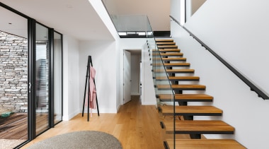 With stone accents outside and timber floors inside, 