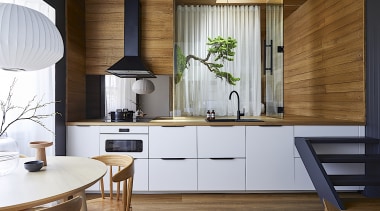 The interior designers opened up the kitchen, living, 