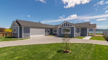 A generous drive, two-car garage and the home's 