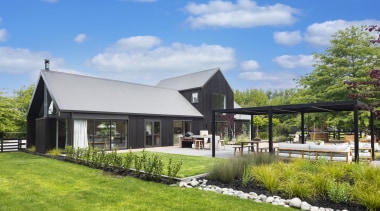 River stones help delineate a flower bed. - 