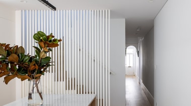 The stairs are screened from the rear living 