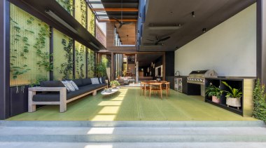 A generous covered living space extends the social 