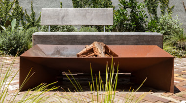 Beyond the home is a low-maintenance garden with 