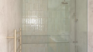 Pale green tiles and glass make for a 