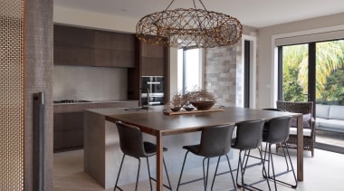 The kitchen exhibits a warm, natural moodiness. 