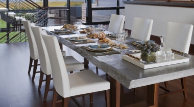 The dining table by John Houshmand is cast 