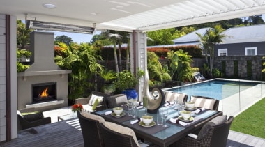 View of outdoor entertainment area, with pool, spa, backyard, grass, house, lawn, outdoor structure, real estate, yard, green, white