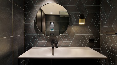 The reworked powder room has quite a different 