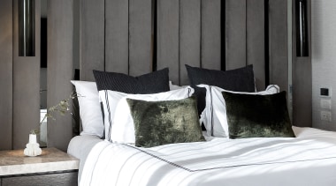 Graceful hanging materials strips are backed by a 