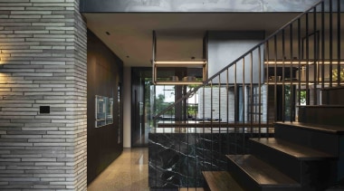 Stairs rise next to the kitchen in the 