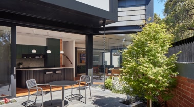 The contemporary new addition from the garden. 