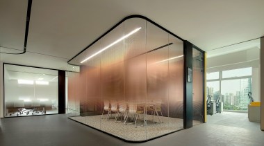 Private conference room in open-plan context. 