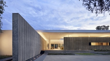 Heavy cast-concrete walls extend from the interior of 