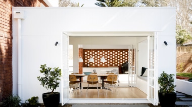 Bifold doors open the dining space to the 