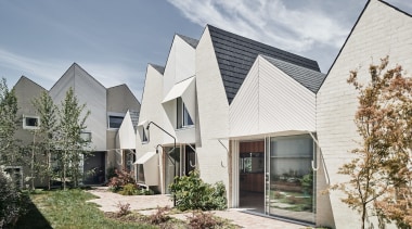 RaeRae's mountain roof form is shaped through context gray, white