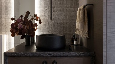 The rock edge stone benchtop is matched with 