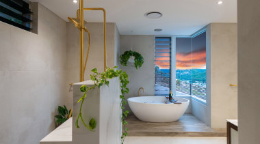 A half wall in the shower area provide 