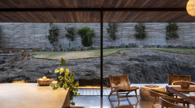 The rear of the house sits into the 