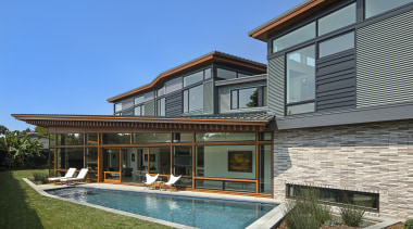 The Venice House creates a garden sanctuary in backyard, cottage, elevation, estate, facade, home, house, property, real estate, residential area, siding, swimming pool, villa, window, teal