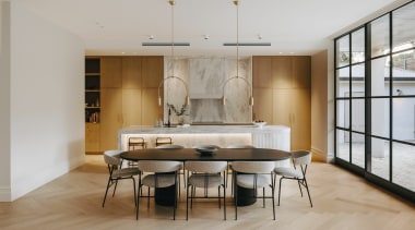The kitchen and dining area incorporates statement Madame 