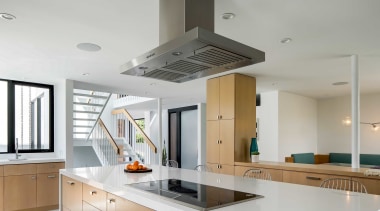 The custom, light-filled kitchen benefits from a large 