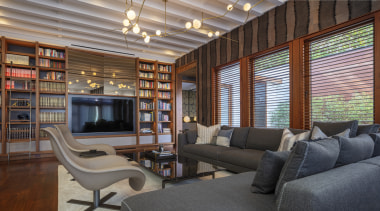 A mirrored element above the television accentuates the 