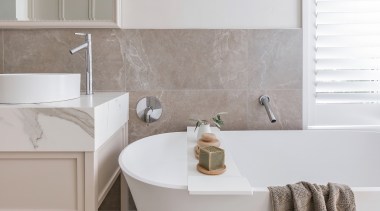 The freestanding tub also has a classic air. 