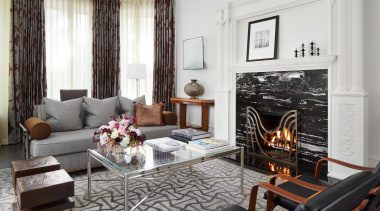 Family room with exotic rug and custom fire 