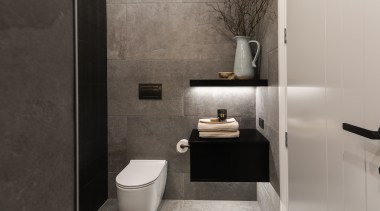 The toilet roll holder has been placed to 