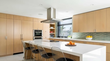 The custom kitchen’s airy feel owes to the 